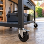 Close-up of a braked rubber castor on the mobile workbench