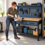 Woman sawing timber held in a clamp on the pegboard workbench