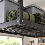 Close-up of a telescopic drop-down post and locking pin of the ceiling rack